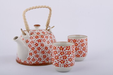 Pink ceramic teapot and tea cups