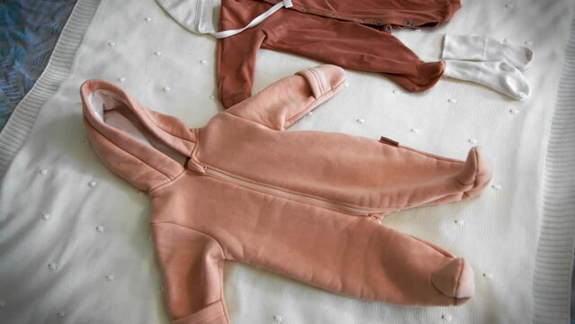 Children's clothes on the bed top view