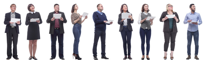 a group of people are holding a tablet and looking to the side
