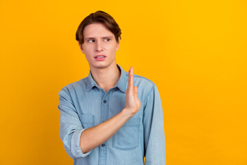 Young boy wearing casual shirt disgusted expression displeased aversion reaction with hands raised make stop sign