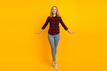 Fototapeta na wymiar Full length of nice-looking lovely cheerful glad wavy-haired girl having fun waking isolated on shine color background