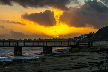 sunset over weymouth from bowleaze cove