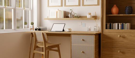 Scandinavian and comfortable home working room interior with tablet mockup on wood table © bongkarn