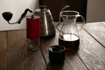Aromatic coffee on wooden table in cafe