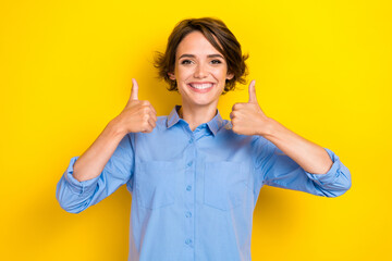 Closeup photo of young attractive positive woman wear blue shirt thumbs up toothy smile recommend...