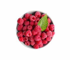 Bowl of fresh ripe raspberries with green leaf isolated on white, top view