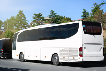Modern white bus on road outdoors. Public transport - obrazy, fototapety, plakaty