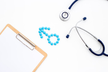 Male sign made of blue pills with doctor clipboard
