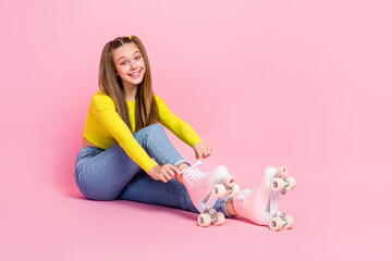 Obraz na płótnie Canvas Full length photo of cool shiny school girl dressed yellow crop top tie rollers empty space isolated pink color background