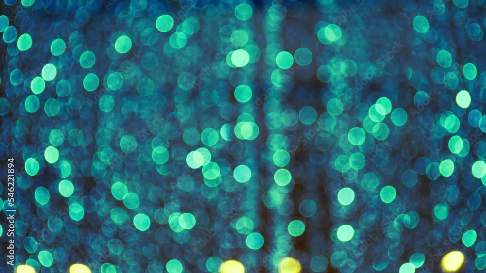 Poster blurred light spots seamless loop circle color bokeh lights background. defocused lens light