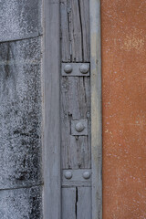 old wooden door with metal details, texture, close up
