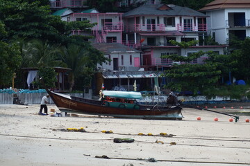 Fototapeta na wymiar Long-tail boat repair on the beach - Koh Phi Phi