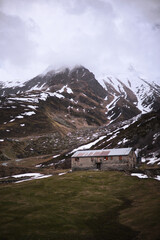 house in the mountains with snow in Switzerland