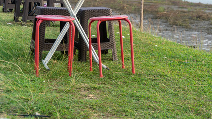 picnic chair and table on the lawn. concept of outdoor coffee shop. portable picnic chair and table