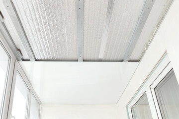 Installation of plastic white panels on the ceiling. Technology of repair, insulation of balconies, loggias.