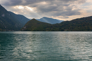 Lake Perucac and Tara mountain with amazing sky at sunset