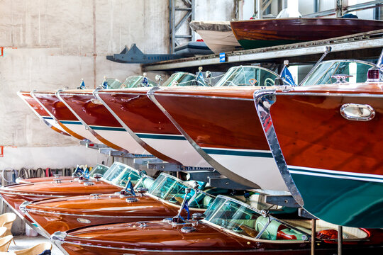 Classic wooden motor boats in shipyard