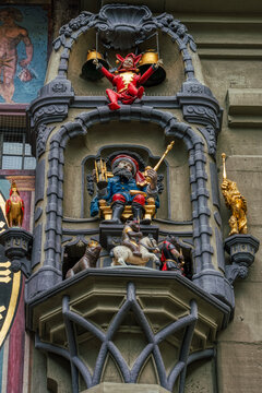 Zytglogge detail, old clock tower in Bern, Switzerland. Closeup of a baroque decorated column with a representation of Duke Berchtold. Clock face or clockface ornate with fancy bell work bellwork