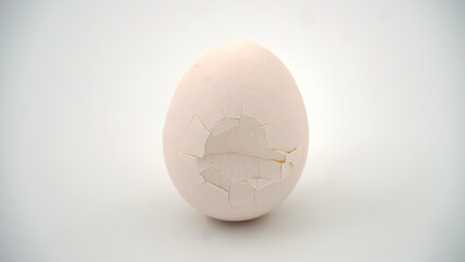 Broken and cracked egg shell on an isolated background
