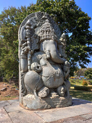 Fototapeta na wymiar 12th-century Ganesha statue outside Shaivism Hindu temple Hoysaleswara arts Halebidu, Karnataka State, India