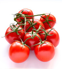 Vine tomatoes on a white background