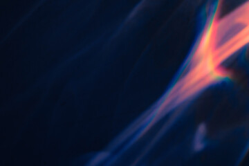 Blur colorful warm pink rainbow light leaks on black background. Defocused abstract analog retro film lens flare bokeh overlay or screen filter effect. Glow Vintage prism, water caustic, surreal light