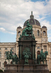 Fototapeta na wymiar Facade of the Natural History Museum and statues of Empress Maria Theresa (ruler of the Habsburg dominions) monument in the old town of Vienna, Austria, Central Europe. Ancient bronze statue closeup. 
