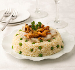 Cooked rice with monkfish and wild mushrooms