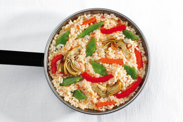 Rice with seasonal vegetables and artichokes,