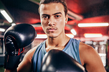 Fitness, boxing gloves and portrait of an athlete training for a fighting match or competition....