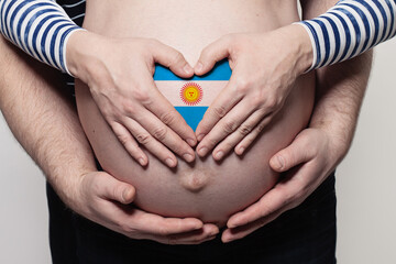 Argentine family concept. Man embracing pregnant woman belly and heart with flag of Argentina...