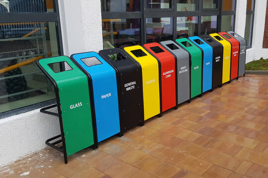 Colorful garbage bins for recycling, garbage separation. Containers for glass, paper, general waste, plastic, aluminum cans and mixed waste
