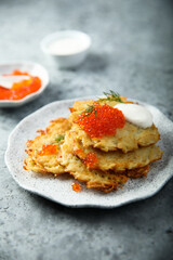 Homemade latkes with red caviar