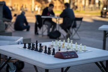 Playing chess in the street, chess board ready for a game, selective focus