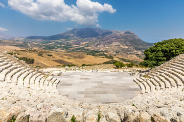 Segesta, Sicily, Italy - July 9, 2020: Ruins of the Greek Theater in Segesta, Sicily, Italy - obrazy, fototapety, plakaty