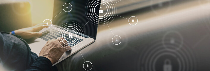 Internet security and data protection concept with man typing on a laptop - web banner with copyspace