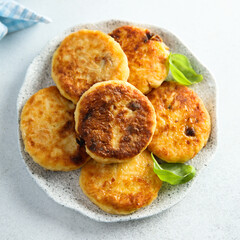 Homemade savory potato pancakes with fresh basil