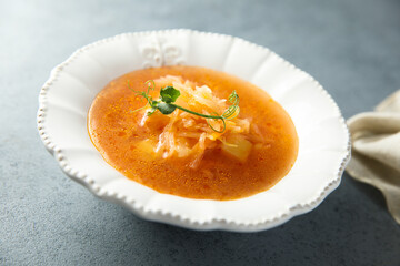 Traditional homemade sauerkraut soup with tomato
