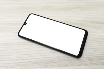 Celular com a tela transparente sobre uma mesa de madeira