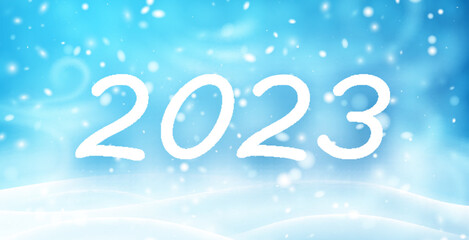 2023 sign with snow bokeh lights background.