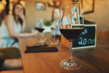 Glass of red wine is on the table. Wine degustation.