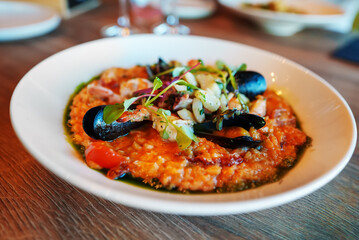 Italian risotto with seafood in restaurant.