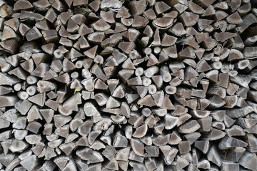 Gray and brown chopped stacked firewood background