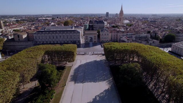 Establishing drone shot of the stunning Triumphal Arch and the Promenade De Peyrou
