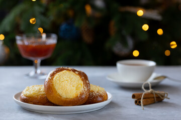 cheesecake with streusel on a concrete background, New Year's tea party with pies and jam near the Christmas tree