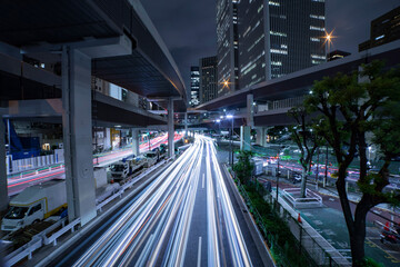 Fototapeta na wymiar A night traffic jam at the urban street in Tokyo wide shot
