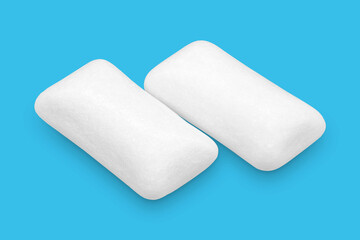 Three pieces of white chewing gum isolated on white. The whole subject is in focus.