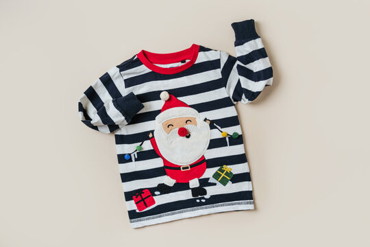 Childrens jumper with Santa Claus. Kids clothes and accessories for Christmas party. Fashion baby clothes.