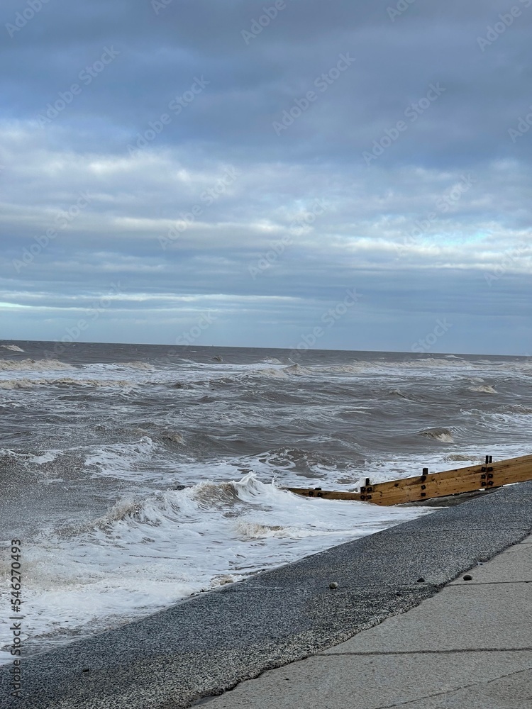 Canvas Prints Waves crashing onto the beach and sea wall during high tide. Taken in Cleveleys Lancashire England. 