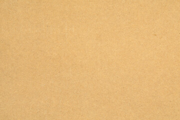Fototapeta na wymiar Seamless texture of durable cardboard, detailed surface of yellow recycled cardboard